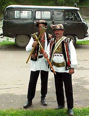 Hutsuls in folk clothes with axes