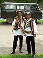 Hutsuls in folk clothes with axes